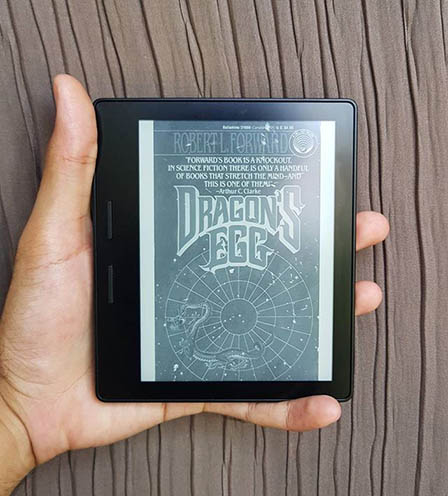 A picture of a Kindle with the cover of Dragon's Egg book on display.