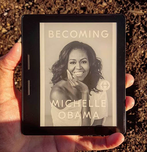 A picture of a Kindle with the book cover of Becoming on display.