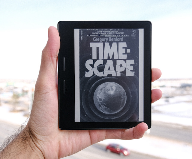 A picture of a Kindle with the book cover of 'Timescape' on display.