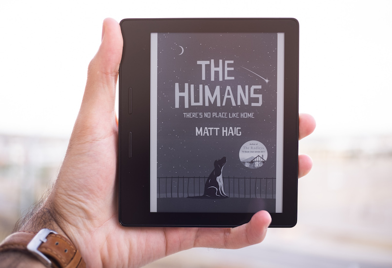 A picture of a Kindle with the book cover of 'The Humans' on display.